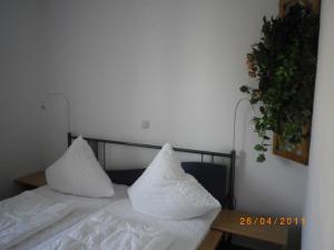 Ein Bett oder Betten in einem Zimmer der Unterkunft Zinnowitz Residenz Sanssouci