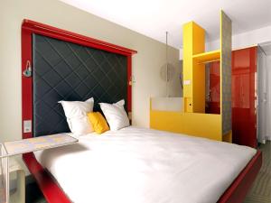 Postel nebo postele na pokoji v ubytování ibis Styles Hotel Berlin Mitte