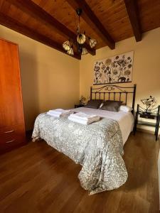 a bedroom with a large bed in a room at VillaMerceditas in Rasines