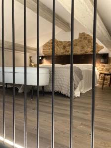 a bedroom with a bed in a attic at Casa María da Retratista in Muxia