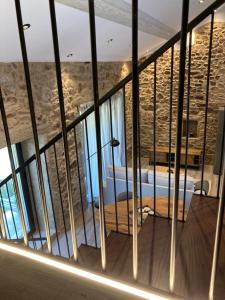 a view of a room with a stone wall at Casa María da Retratista in Muxia