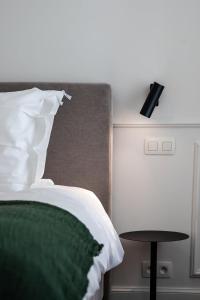 Cama ou camas em um quarto em Villa Ostinato
