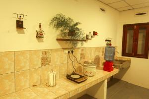 a kitchen with a counter top with a blender on it at Navis villa in Galle
