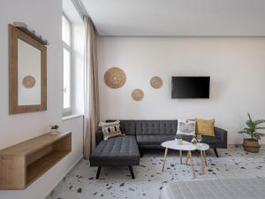 a living room with a couch and a table at Cretan Berry Kondylaki in Chania Town