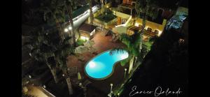 an overhead view of a swimming pool at night at Borgo Barone in Mascali