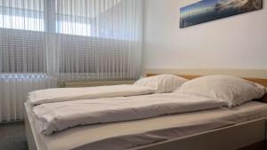 En eller flere senge i et værelse på Haus Trafalgar Whg. 242 Möwennest
