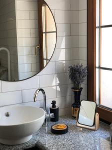 a bathroom with a white tub and a mirror at Dom w Dolinie Zdrowia in Wleń +45 photos