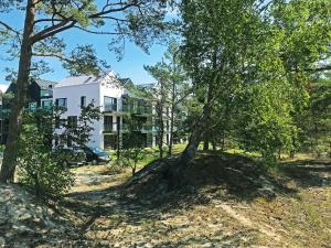 Κήπος έξω από το Apartament 23 w Porto Łeba