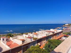a view of the ocean from a building at Sunset Apartment in Santa Marinella