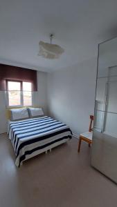 A bed or beds in a room at A Million Dollar View In the Heart of the City