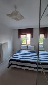 A bed or beds in a room at A Million Dollar View In the Heart of the City