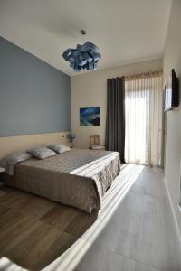 Säng eller sängar i ett rum på Daman Rooms & Breakfast