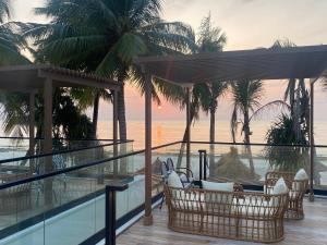 a view of the ocean from the balcony of a resort at TOA Hotel & Spa Zanzibar in Pongwe