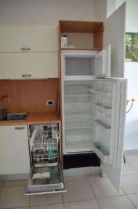an empty refrigerator with its door open in a kitchen at Ferienwohnung-Casa-Uta-Gardasee-Limone-Tremosine in Tremosine Sul Garda