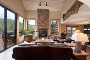 a living room with a couch and a fireplace at Cascade Village 48 in Durango Mountain Resort