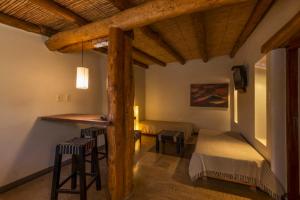 Ένα ή περισσότερα κρεβάτια σε δωμάτιο στο Al Sereno Hotel y Spa