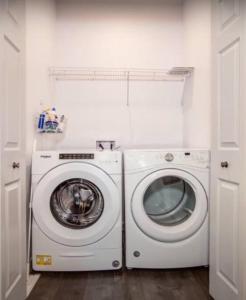 a washing machine and a washer in a room at THREE TREE VILLA w/ EV Charging in Yucca Valley