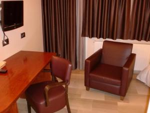 TV i/ili multimedijalni sistem u objektu Hotel & Spa Can Josep