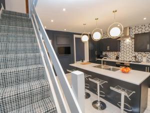 an open kitchen and staircase in a house at 16 Seafield Terrace in South Shields