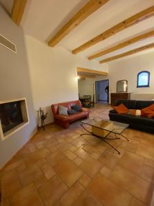 a large living room with couches and a table at Eden in Le Thor