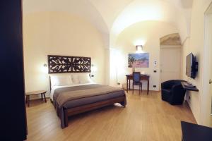 Ένα ή περισσότερα κρεβάτια σε δωμάτιο στο Negramaro Suite B&B