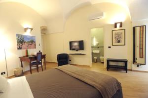 Ένα ή περισσότερα κρεβάτια σε δωμάτιο στο Negramaro Suite B&B