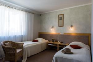 Postel nebo postele na pokoji v ubytování Hotel Sanvilla
