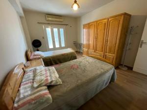 A bed or beds in a room at Deluxe room in Degla,Maadi