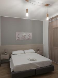 En eller flere senge i et værelse på Amunì