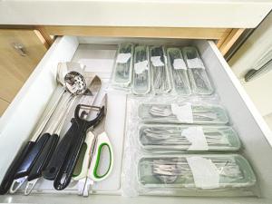 a drawer with scissors and other kitchen utensils in it at Bangi,4-7pax,Cozy Studio,Near UKM in Kajang