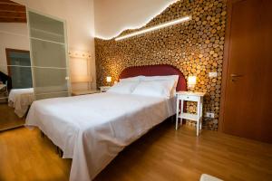 Postel nebo postele na pokoji v ubytování Affittacamere LA SCALA