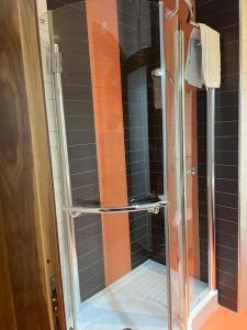 a shower with a glass door in a bathroom at Apartment 5 mins away from the sea in St. Paul's Bay