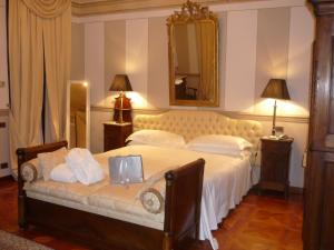 Postel nebo postele na pokoji v ubytování Hotel Villa Beccaris