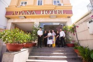 a group of people standing in front of a hotel at Atana Hotel in Ho Chi Minh City