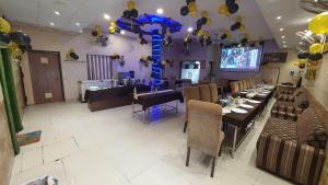 a dining room with tables and chairs and balloons at Hotel Amritsar Inn in Amritsar