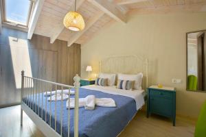 Postel nebo postele na pokoji v ubytování Aliki Beach House