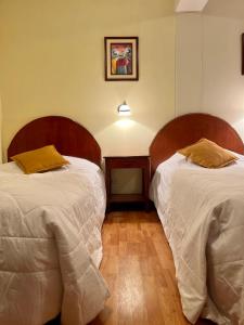 Letto o letti in una camera di Hotel Vilandre