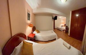 Letto o letti in una camera di Hotel Vilandre
