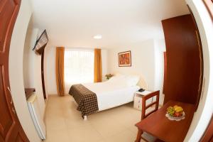 Postel nebo postele na pokoji v ubytování Astorga Hotel Arequipa