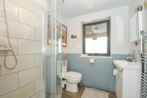 a bathroom with a toilet and a sink at Lillemor in Okehampton +19 photos