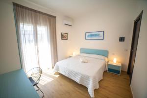 Posteľ alebo postele v izbe v ubytovaní Medoro Camere Milazzo