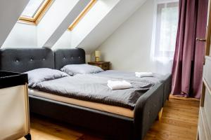 Posteľ alebo postele v izbe v ubytovaní Apartmán Líštička