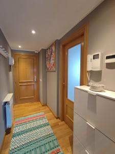 a kitchen with a refrigerator and a counter top at El Mirador de Murillo in Murillo de Río Leza