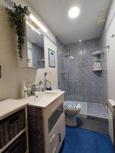a bathroom with a sink and a toilet at El Mirador de Murillo in Murillo de Río Leza
