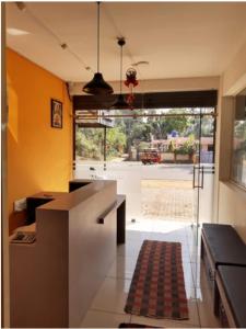 a kitchen with an open door to a yard at Chakalakkal Residency in Sultan Bathery