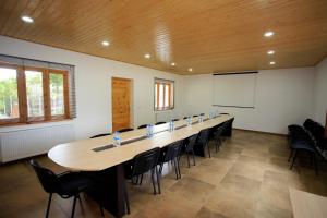 a large room with a long table and chairs at Nazy's Guest House in Joqolo