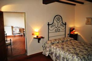 a bedroom with a bed in a room with a mirror at Universal Harmony Agriturismo in Dicomano