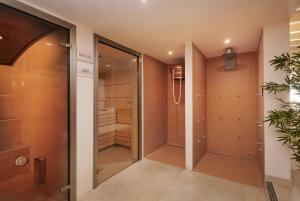 a walk in closet with a glass door at Es Figueral Nou Hotel Rural & Spa - Adults Only - Over 12 in Montuiri