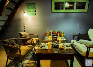 a living room with a table and a couch at VagaMundo Hostel Carhue in Carhué +45 photos