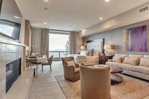 a living room with a couch and a bed at Platinum Room Hotel Room in Park City